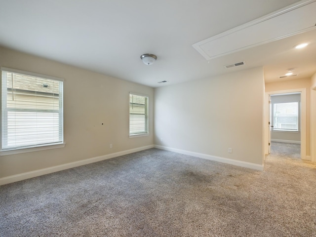 spare room featuring carpet flooring