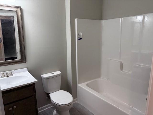 full bathroom featuring tile patterned floors, vanity, bathtub / shower combination, and toilet