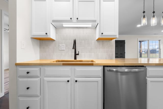 kitchen featuring stainless steel dishwasher, sink, decorative light fixtures, white cabinets, and backsplash