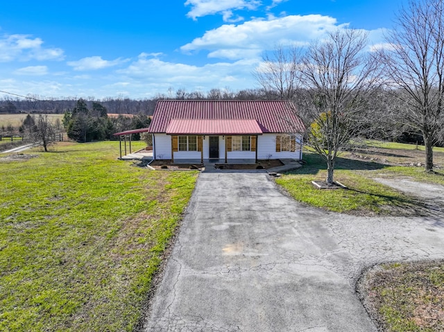 single story home with covered porch and a front lawn