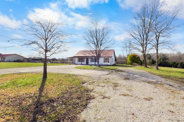 ranch-style house with a front yard