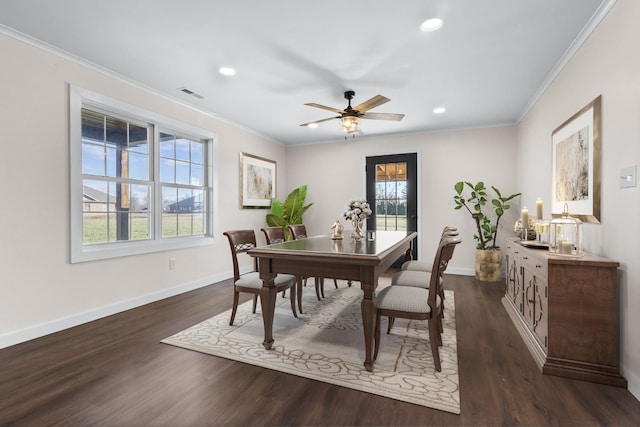 dining room featuring crown molding, ceiling fan, and dark hardwood / wood-style flooring