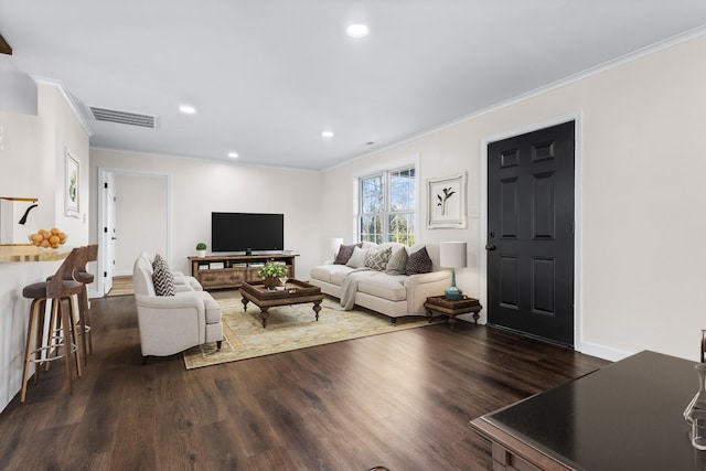 living room with dark hardwood / wood-style floors and ornamental molding