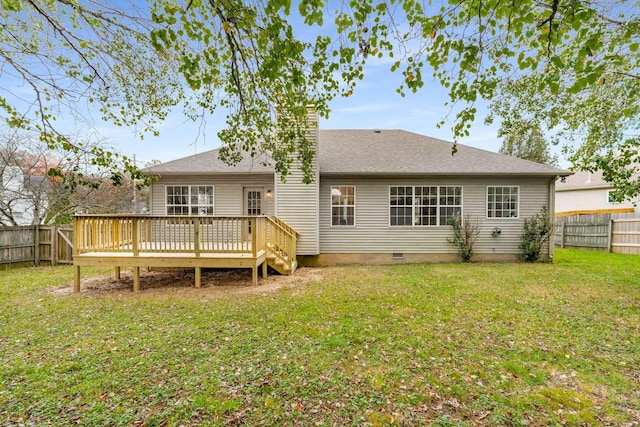 back of property featuring a yard and a wooden deck