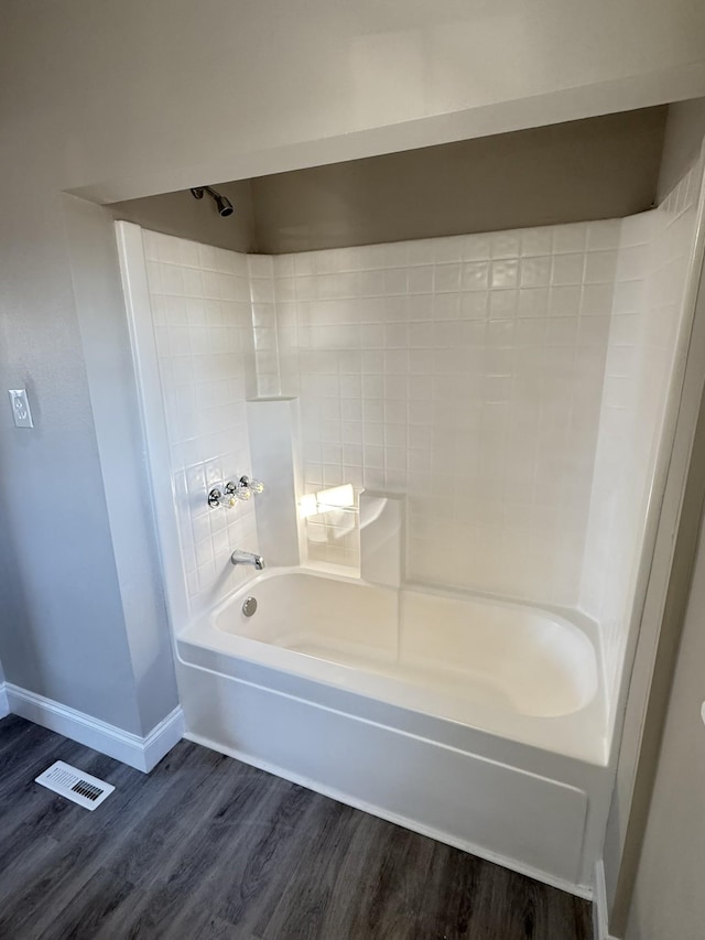 bathroom featuring hardwood / wood-style floors and shower / bath combination