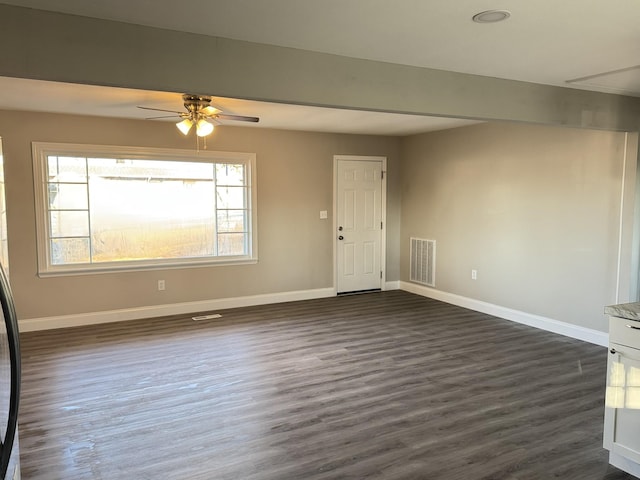 interior space featuring ceiling fan and dark hardwood / wood-style flooring