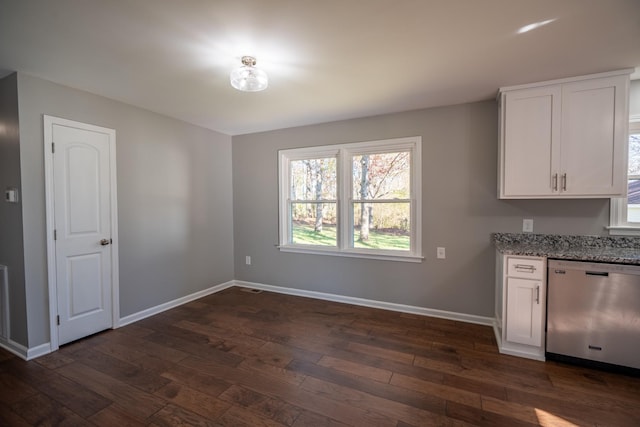 unfurnished dining area featuring dark hardwood / wood-style floors