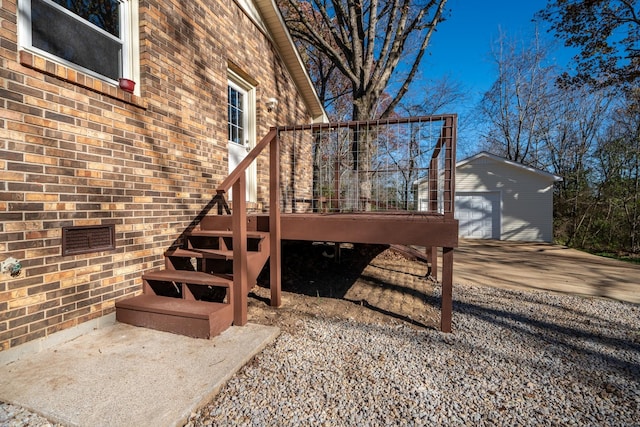 view of side of home with a garage, an outdoor structure, and a deck