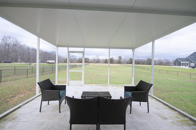 sunroom / solarium with a rural view