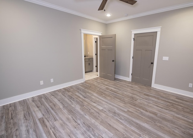 unfurnished bedroom featuring ceiling fan, ornamental molding, light hardwood / wood-style flooring, and ensuite bath