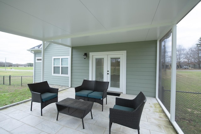 sunroom featuring french doors and plenty of natural light