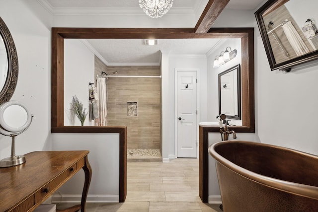 bathroom with curtained shower, vanity, a chandelier, and ornamental molding