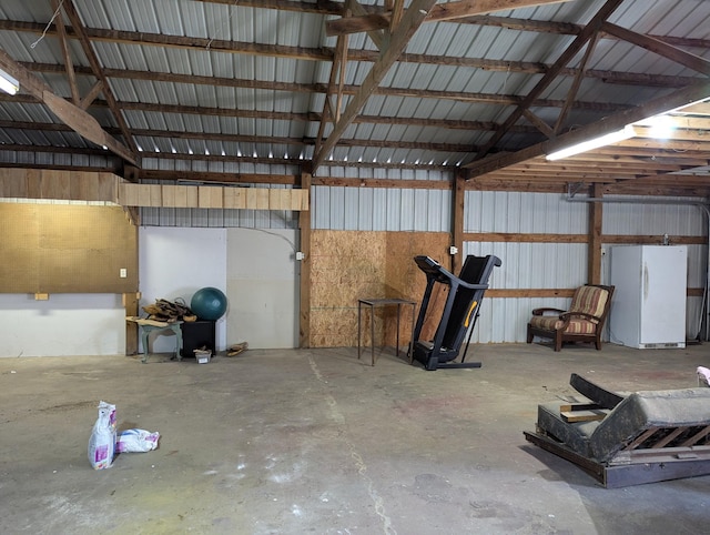 garage featuring white fridge