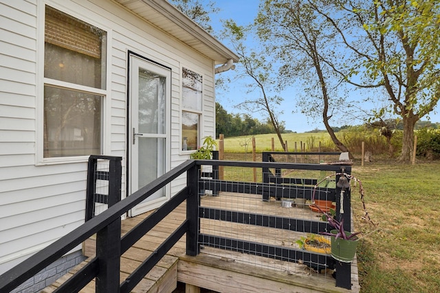 deck featuring a lawn