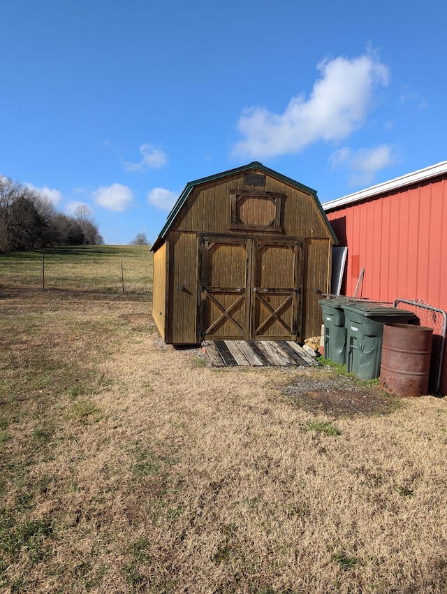 view of outbuilding featuring a rural view