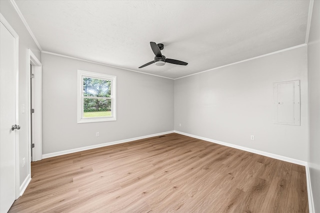 spare room with light hardwood / wood-style flooring, ceiling fan, and crown molding