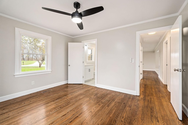 unfurnished bedroom with dark hardwood / wood-style floors, ceiling fan, and crown molding