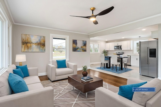 living room with ceiling fan, crown molding, and light hardwood / wood-style flooring