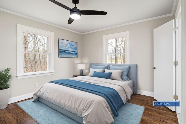 bedroom featuring ceiling fan, dark hardwood / wood-style floors, and crown molding