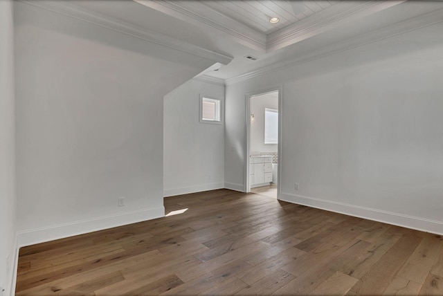 additional living space featuring visible vents, baseboards, and hardwood / wood-style floors