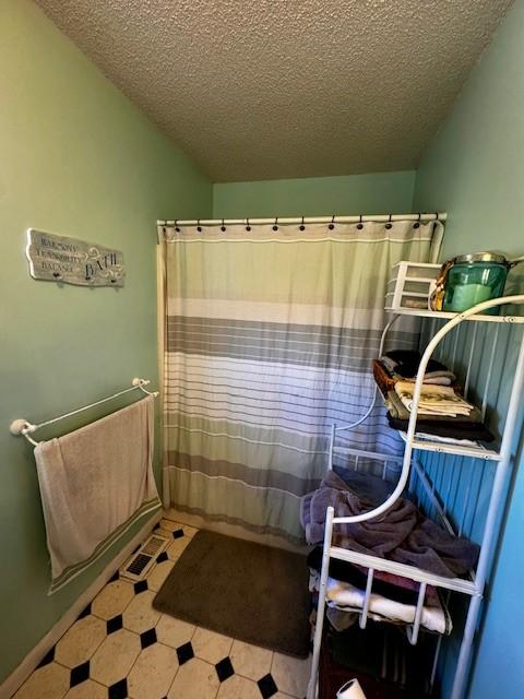 bathroom with a textured ceiling