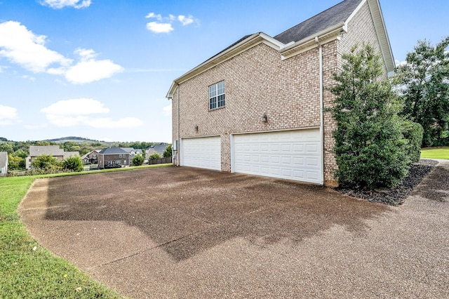 view of property exterior with a garage