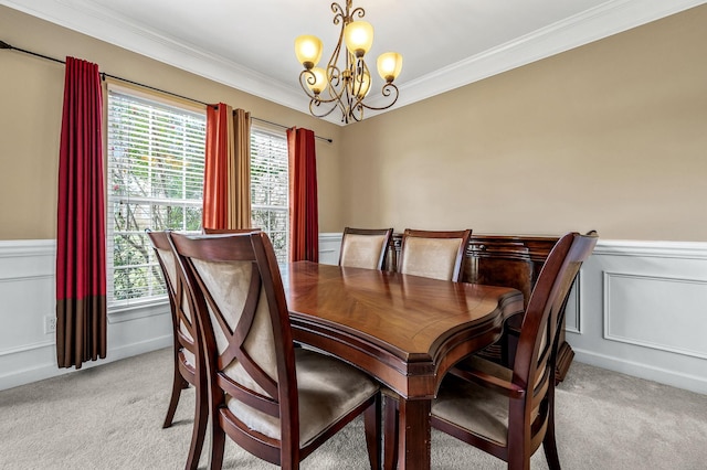 dining room featuring a notable chandelier, a healthy amount of sunlight, ornamental molding, and light carpet