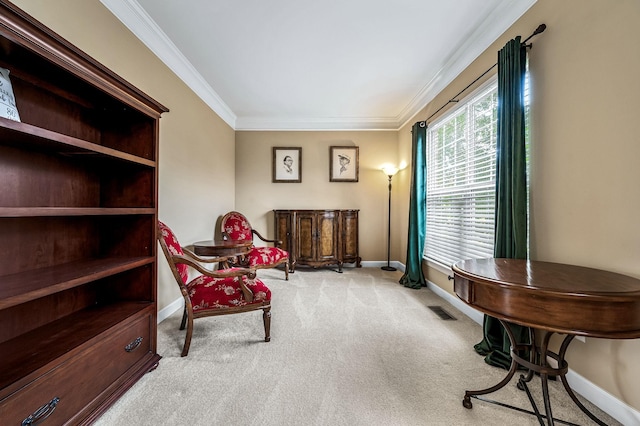 sitting room with light carpet and ornamental molding