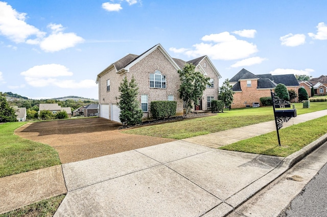 front facade with a front lawn and a garage