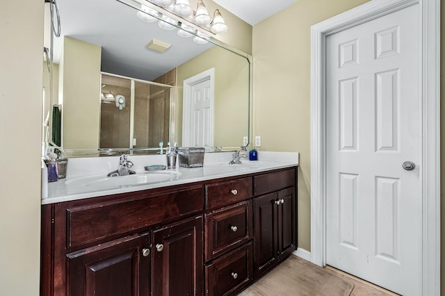 bathroom featuring vanity and walk in shower