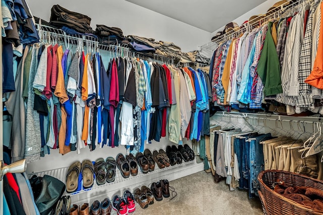 walk in closet featuring carpet floors