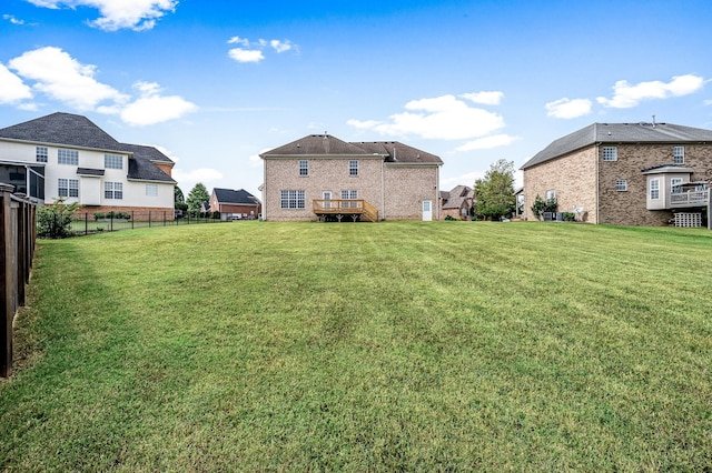 view of yard featuring a wooden deck