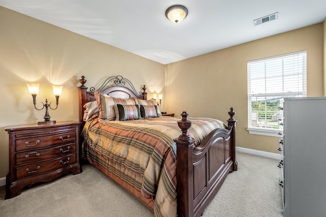 bedroom featuring light carpet