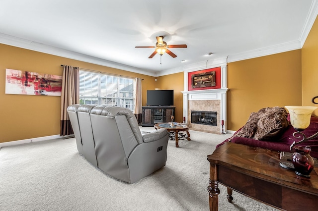 carpeted living room featuring ceiling fan and ornamental molding