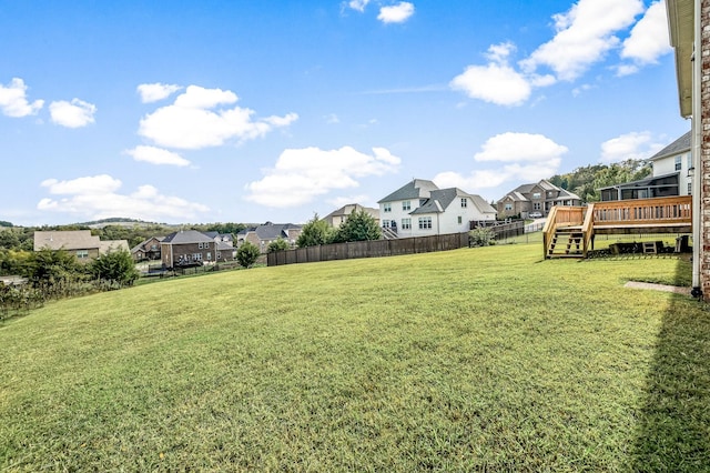 view of yard with a wooden deck