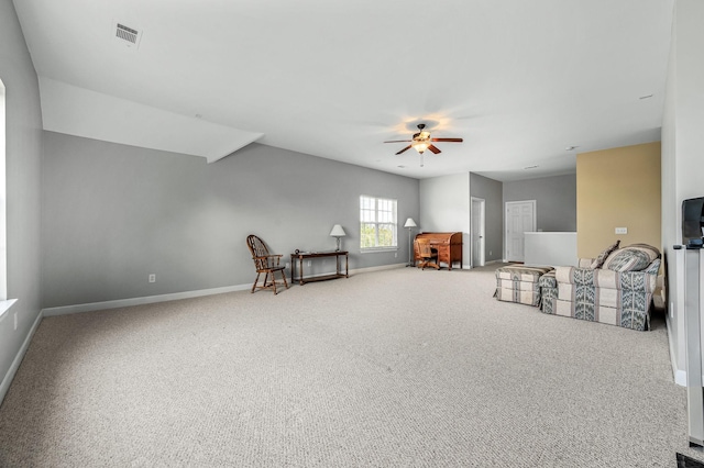 living area with ceiling fan and carpet floors