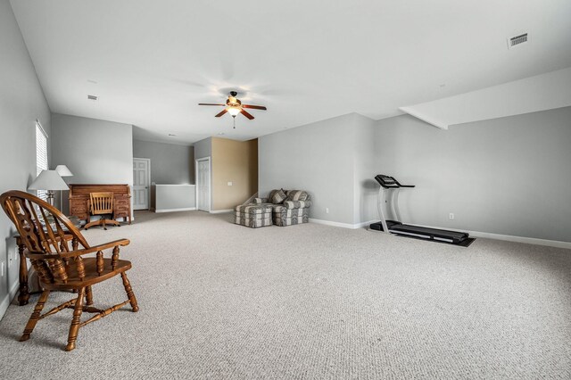 living area featuring carpet flooring and ceiling fan