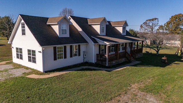 exterior space featuring covered porch and a yard