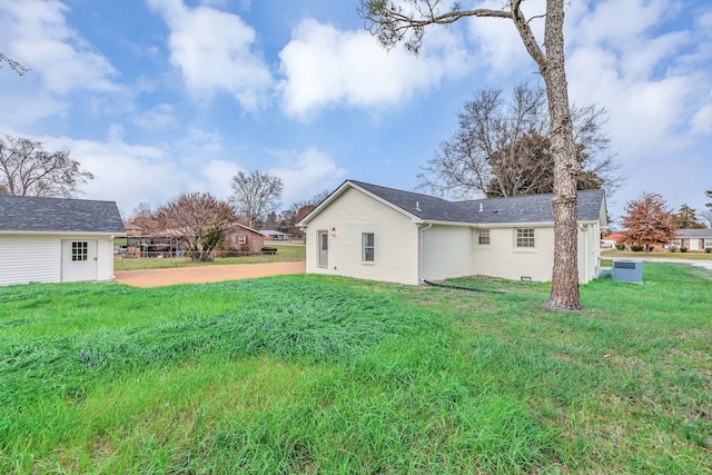 rear view of house with a lawn