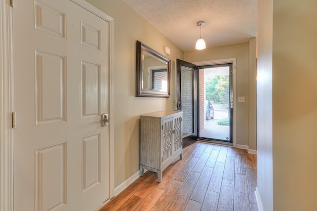 entryway featuring a textured ceiling