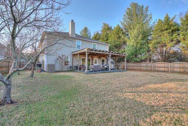 rear view of property with a pergola, outdoor lounge area, a patio area, and a yard