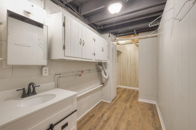 washroom with light wood-type flooring and sink