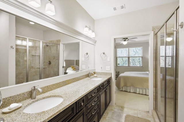 bathroom featuring ceiling fan, a shower with door, and vanity