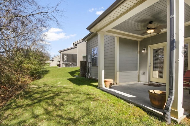 view of yard with ceiling fan