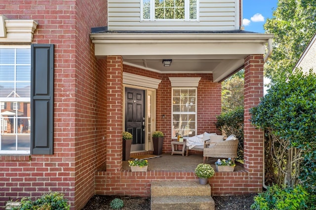 doorway to property featuring covered porch