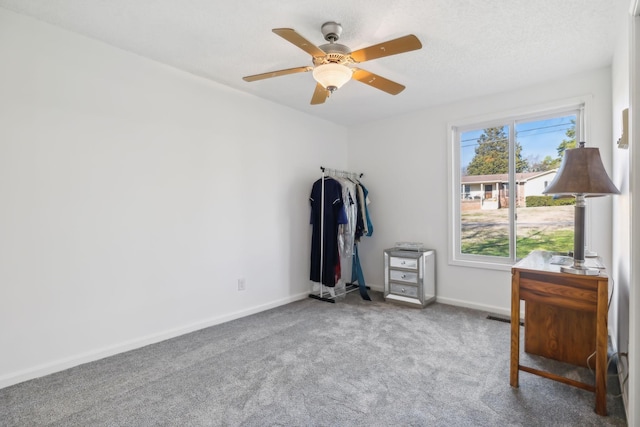 interior space featuring carpet and ceiling fan