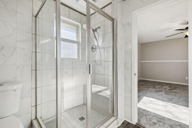 bathroom with ceiling fan, toilet, and walk in shower