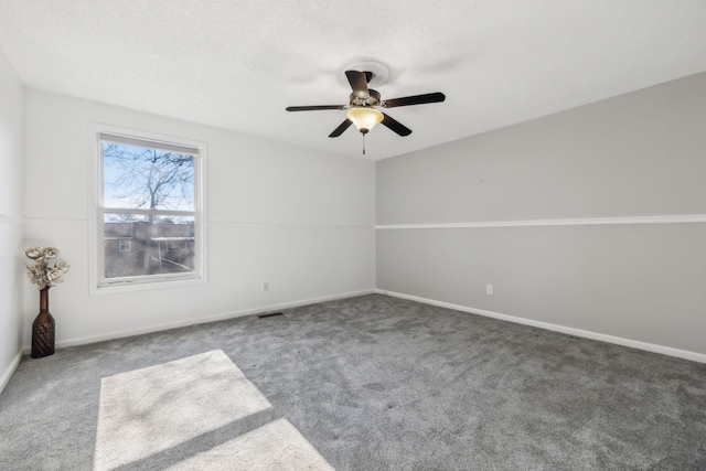 spare room with ceiling fan and carpet floors