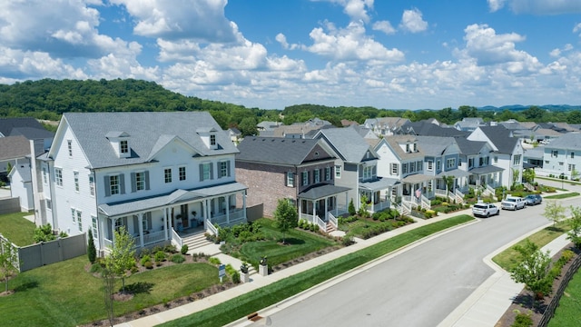 birds eye view of property with a residential view