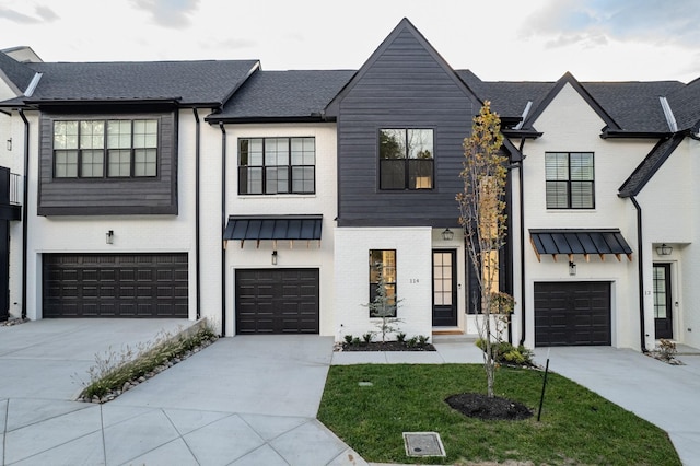 view of front of home with a garage